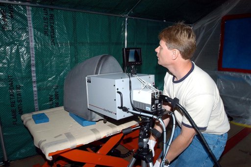 KENNEDY SPACE CENTER, FLA. -  Jim Landy, NDE specialist with United Space Alliance (USA), examines a Reinforced Carbon Carbon panel using flash thermography.  A relatively new procedure at KSC, thermography uses high intensity light to heat areas of the panels. The panels are then immediately scanne