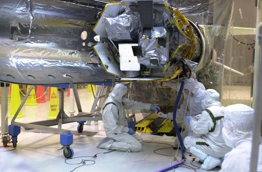 Technicians prepare the AIM spacecraft for fairing installation