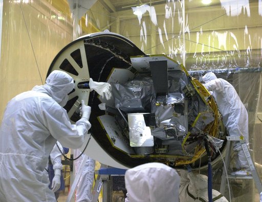 Technicians prepare the AIM spacecraft for fairing installation