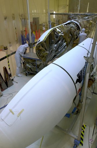 Technicians prepare the AIM spacecraft for fairing installation