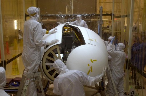 Technicians prepare the AIM spacecraft for fairing installation