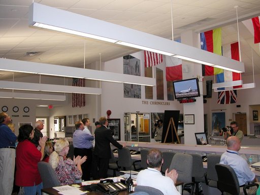 Media and staff in the NASA News Center at Kennedy Space Center