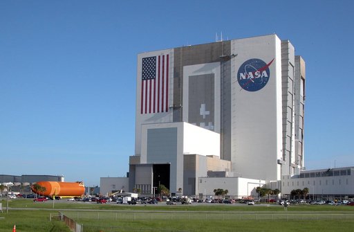 External Tank No. 120 heads for the open door of the VAB