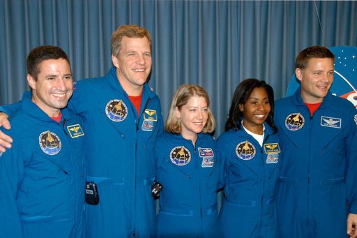 STS-120 crew pose for photographers
