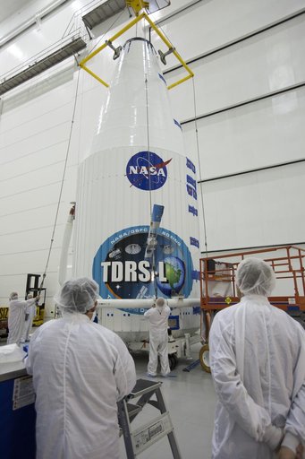 TDRS-L Spacecraft is Lifted Onto Transporter