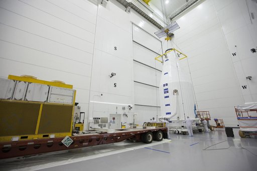 TDRS-L Spacecraft is Lifted Onto Transporter