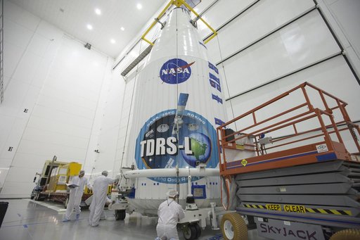TDRS-L Spacecraft is Lifted Onto Transporter