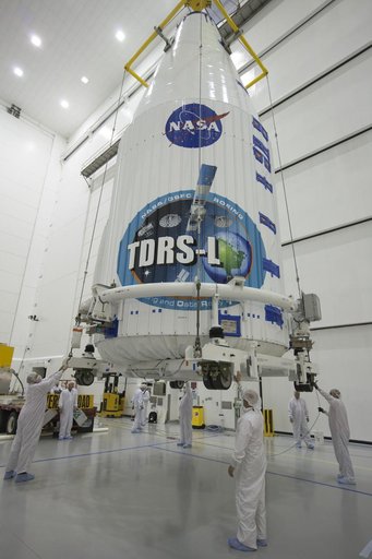 TDRS-L Spacecraft is Lifted Onto Transporter