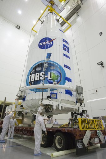 TDRS-L Spacecraft is Lifted Onto Transporter