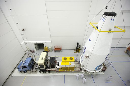 TDRS-L Spacecraft is Lifted Onto Transporter