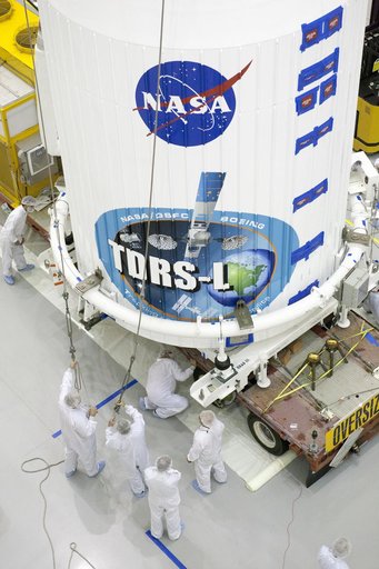 TDRS-L Spacecraft is Lifted Onto Transporter