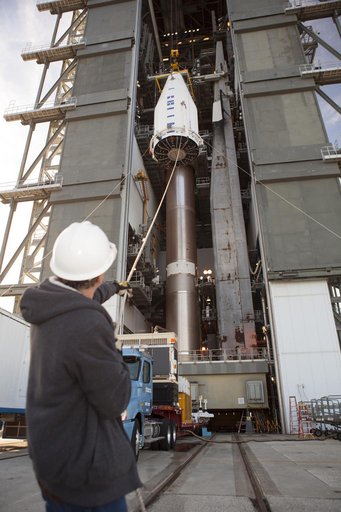 TDRS-L spacecraft lift to mate on Atlas V