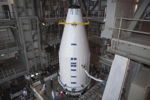 TDRS-L spacecraft lift to mate on Atlas V