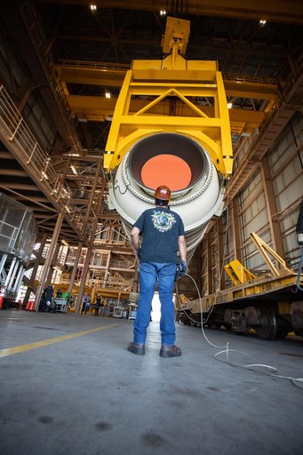 Artemis I Booster Segments Lift to Work Stand and Silhouettes