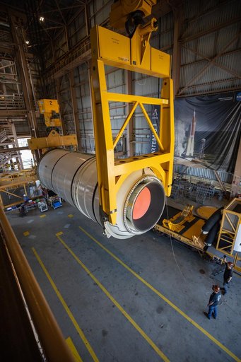 Artemis I Booster Segments Lift to Work Stand and Silhouettes