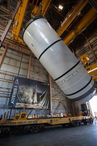 Artemis I Booster Segments Lift to Work Stand and Silhouettes