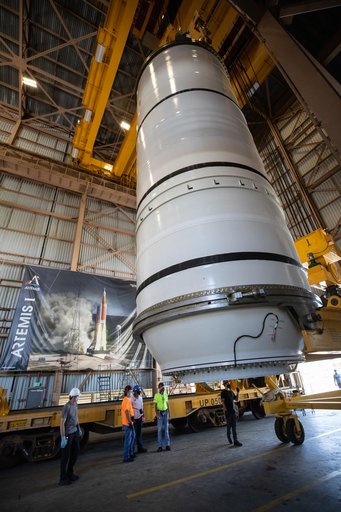 Artemis I Booster Segments Lift to Work Stand and Silhouettes