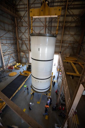 Artemis I Booster Segments Lift to Work Stand and Silhouettes