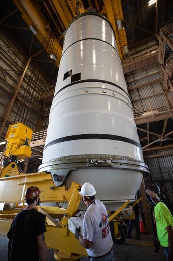 Artemis I Booster Segments Lift to Work Stand and Silhouettes