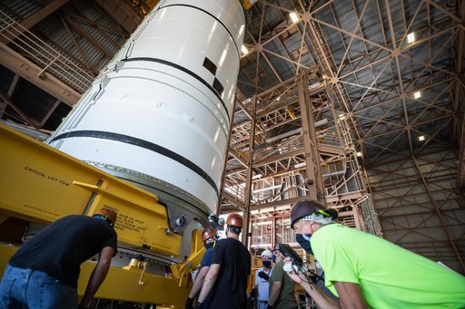 Artemis I Booster Segments Lift to Work Stand and Silhouettes