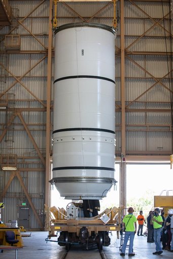 Artemis I Booster Segments Lift to Work Stand and Silhouettes