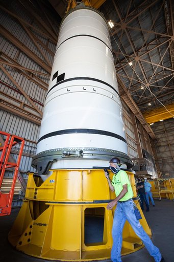 Artemis I Booster Segments Lift to Work Stand and Silhouettes