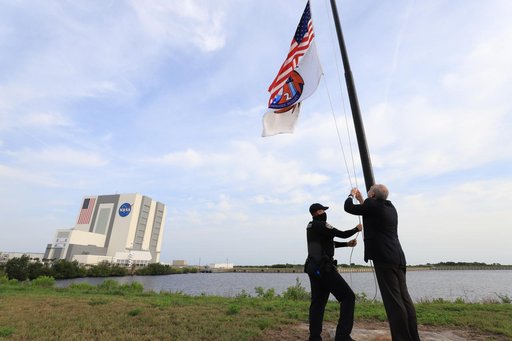NASA Acting Administrator Steve Jurczyk Raises Crew-2 Flag at KS