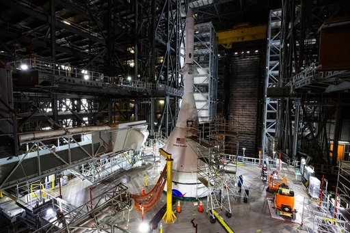 Employees working on Artemis I SLS Flight Hardware