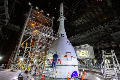 Employees working on Artemis I SLS Flight Hardware