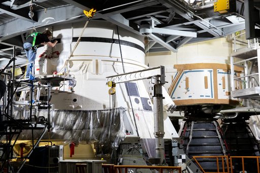 Employees working on Artemis I SLS Flight Hardware