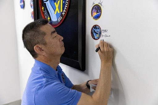Crew-11_Sign their mission patch on the wall