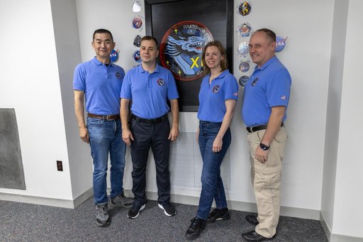 Crew-11_Sign their mission patch on the wall