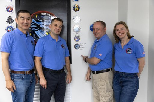 Crew-11_Sign their mission patch on the wall