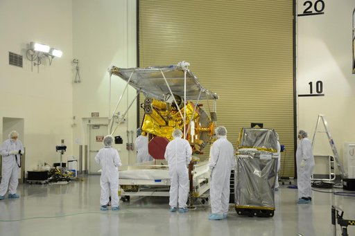 SMAP Spacecraft Rotate & Placed on Fixture