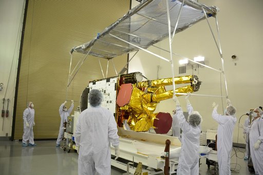SMAP Spacecraft Rotate & Placed on Fixture