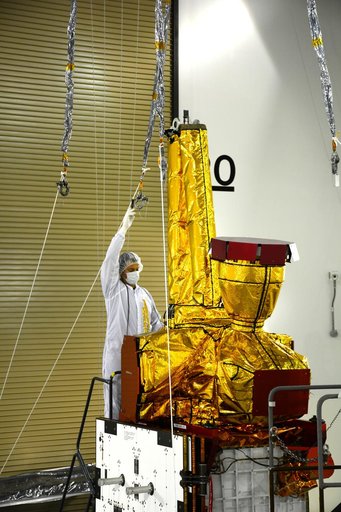 SMAP Spacecraft Rotate & Placed on Fixture