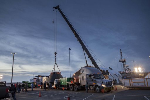 Orion is Taken From Ship & Put in Shipping Container
