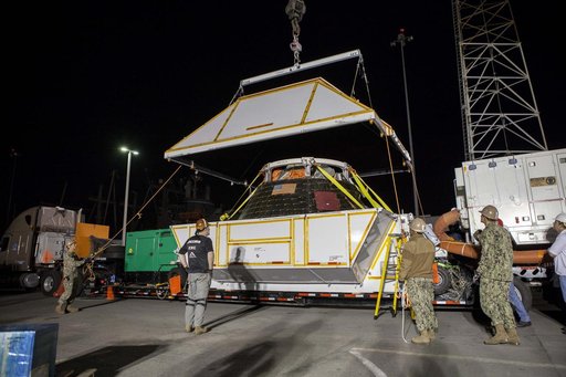 Orion is Taken From Ship & Put in Shipping Container