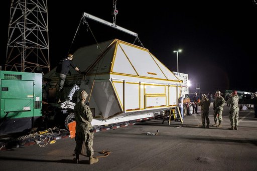 Orion is Taken From Ship & Put in Shipping Container
