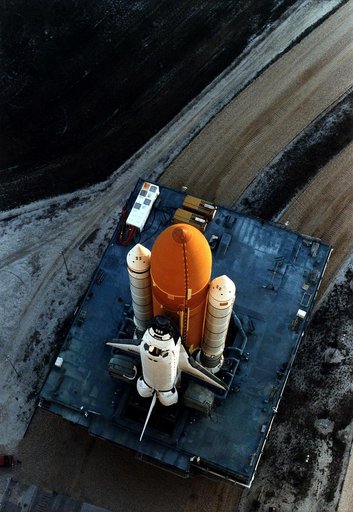 KENNEDY SPACE CENTER, FLA. -  The Space Shuttle Discovery on its Mobile Launcher Platform slowly moves through the high bay doors of the Vehicle Assembly Building en route to Launch Pad 39A, where Discovery is scheduled to lift off on the STS-82 mission on Feb. 11.  A seven-member crew will perform 