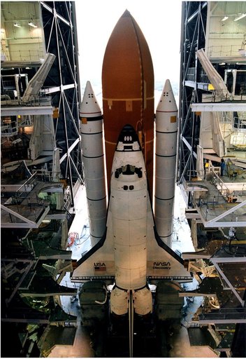 KENNEDY SPACE CENTER, FLA. -  After leaving the Vehicle Assembly Building, the Space Shuttle Discovery makes its slow - up to 1 mile per hour - trek along the crawlerway to Launch Pad 39A in preparation for the STS-82 mission.  The Shuttle is assembled on a Mobile Launcher Platform, seen in this vie