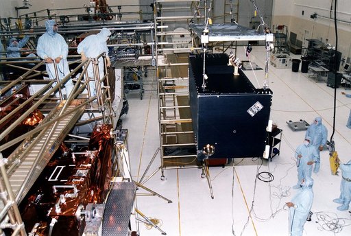 KENNEDY SPACE CENTER, FLA. - Workers in KSC's Vertical Processing Facility lift the Near Infrared Camera and Multi-Object Spectrometer (NICMOS) prior to its installation in the Second Axial Carrier.  NICMOS is one of two new scientific instruments that will replace two outdated instruments on the Hu