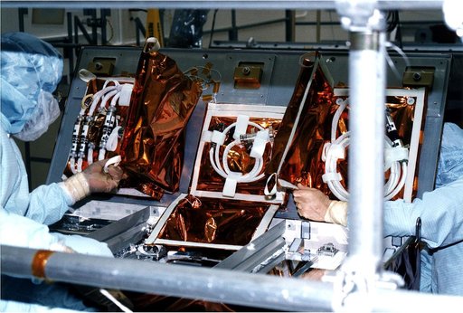 KENNEDY SPACE CENTER, FLA. -  Workers in KSC's Vertical Processing Facility stow cable and adapters into a protective enclosure for the second Hubble Space Telescope servicing mission, STS-82.  Liftoff aboard Discovery is targeted Feb. 11 with a crew of seven.