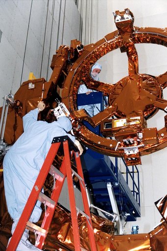 KENNEDY SPACE CENTER, FLA. -  STS-82 Mission Specialist Gregory J. Harbaugh, at top, inspects part of the Flight Support System during the Crew Equipment Integration Test (CEIT) at KSC's Vertical Processing Facility.  Harbaugh and the other six STS-82 crew members will conduct the second Hubble Spac