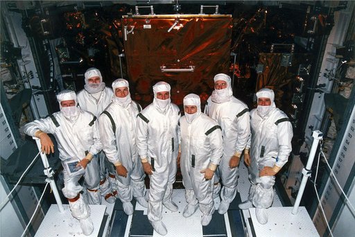 KENNEDY SPACE CENTER, FLA. -   STS-82 crew members pose in their clean room suits at Launch Pad 39A where the Space Shuttle Discovery is undergoing final preparations for liftoff on the second Hubble Space Telescope (HST) servicing mission.  They are making a final inspection of the payload before p