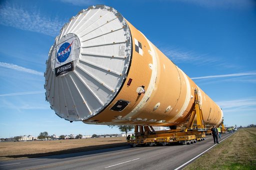 NASA Moves First Artemis SLS Rocket Stage from NASA’s Factory to Barge