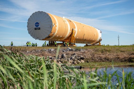 NASA Moves First Artemis SLS Rocket Stage from NASA’s Factory to Barge