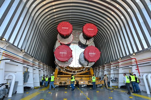 NASA Moves First Artemis SLS Rocket Stage from NASA’s Factory to Barge