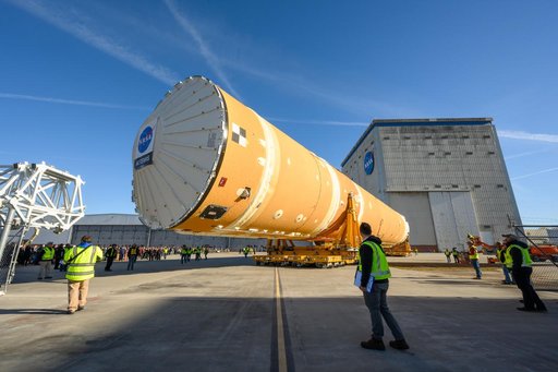 NASA Moves First Artemis SLS Rocket Stage from NASA’s Factory to Barge