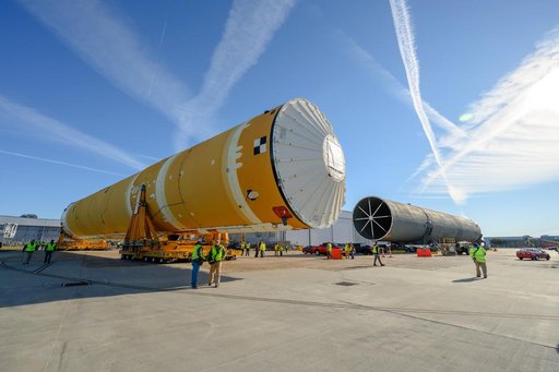 NASA Moves First Artemis SLS Rocket Stage from NASA’s Factory to Barge